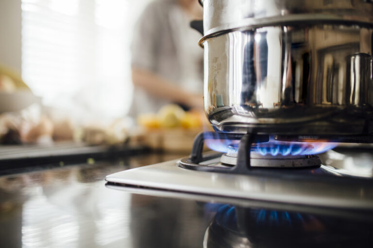 Vegetable steamer on a gas hob.