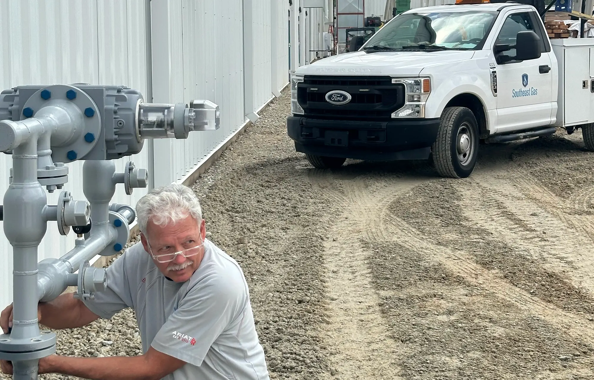 Male technician working on a gas water heater