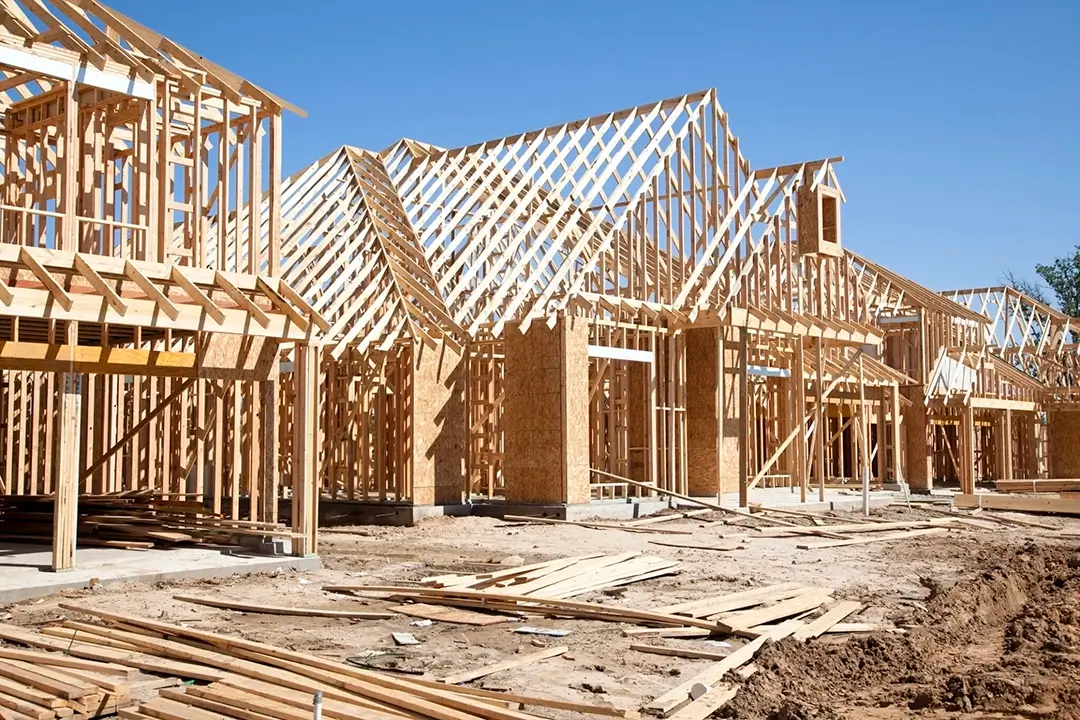 Framing of new houses under construction, highlighting residential development and future growth in Southeast Alabama.